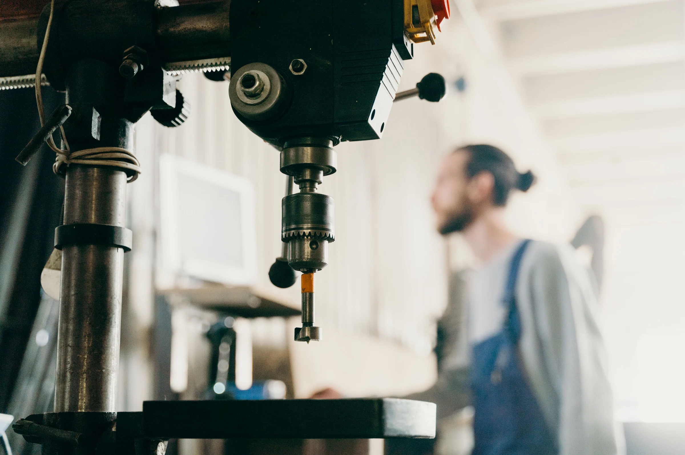 Industrial workshop with machinery and a worker