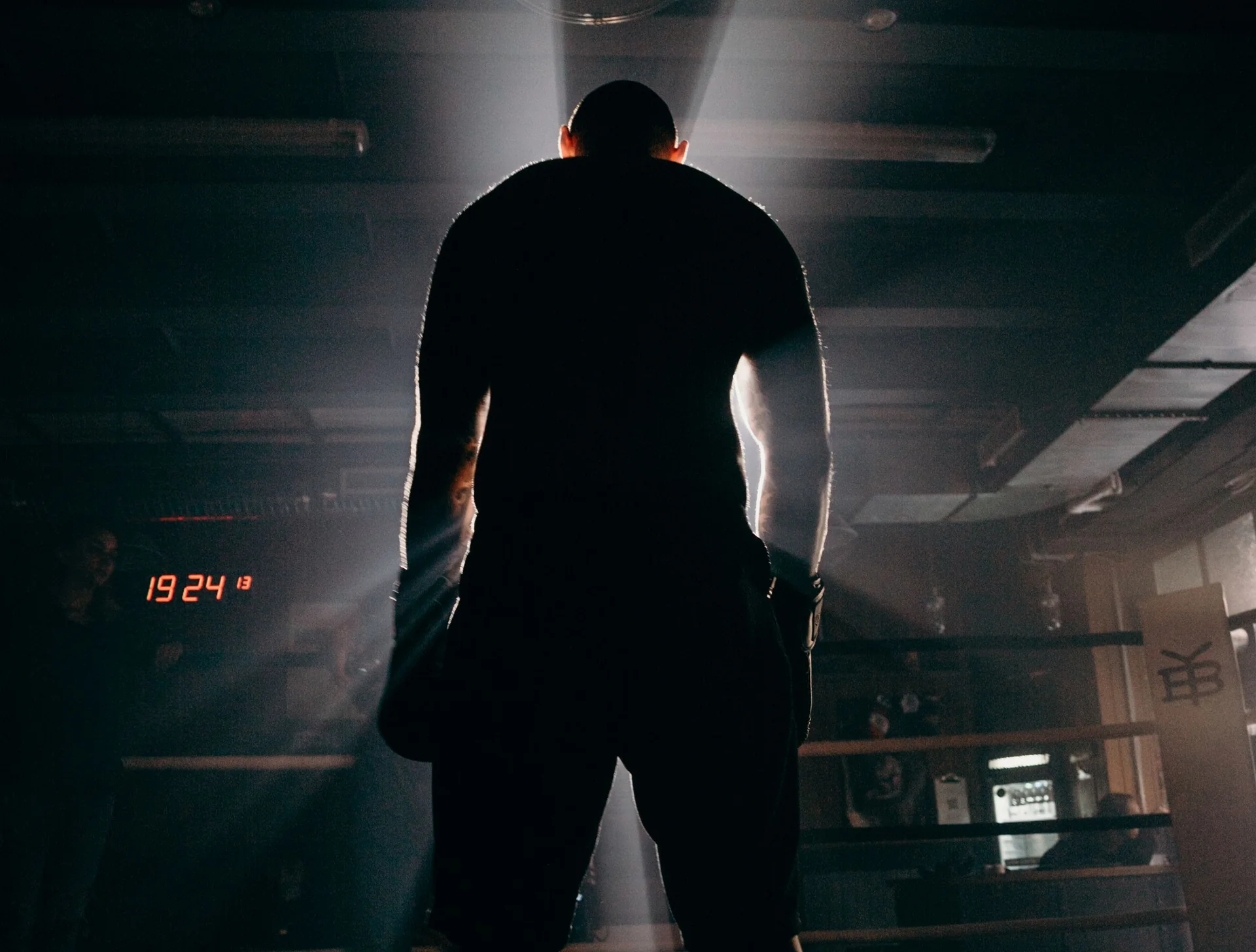 Boxer training in a gym illuminated by sunlight
