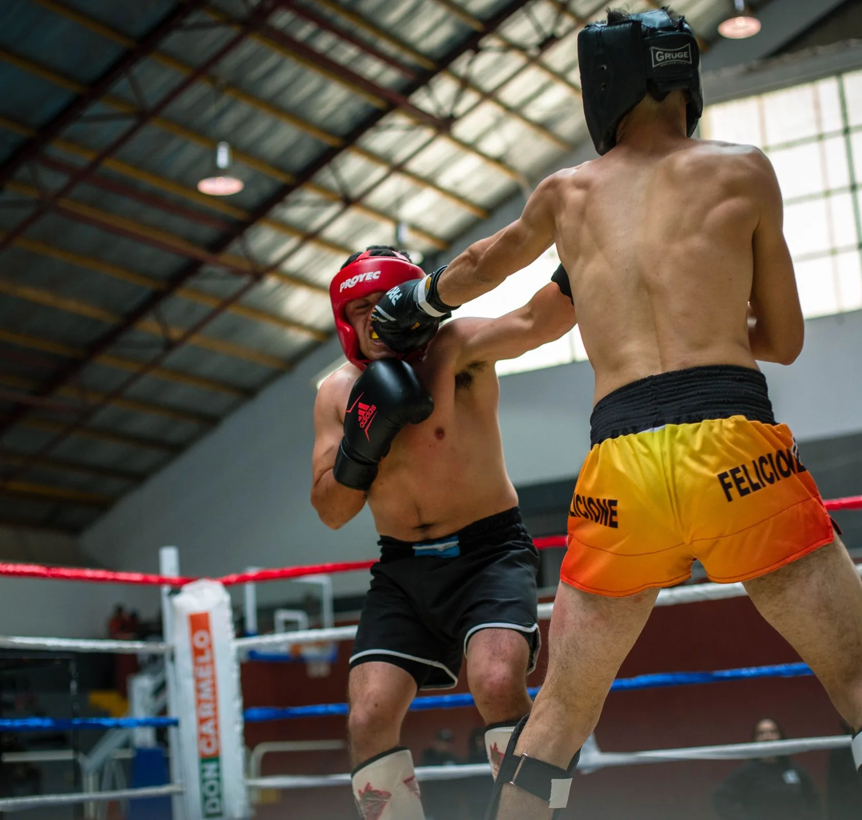 Two boxers competing in a ring
