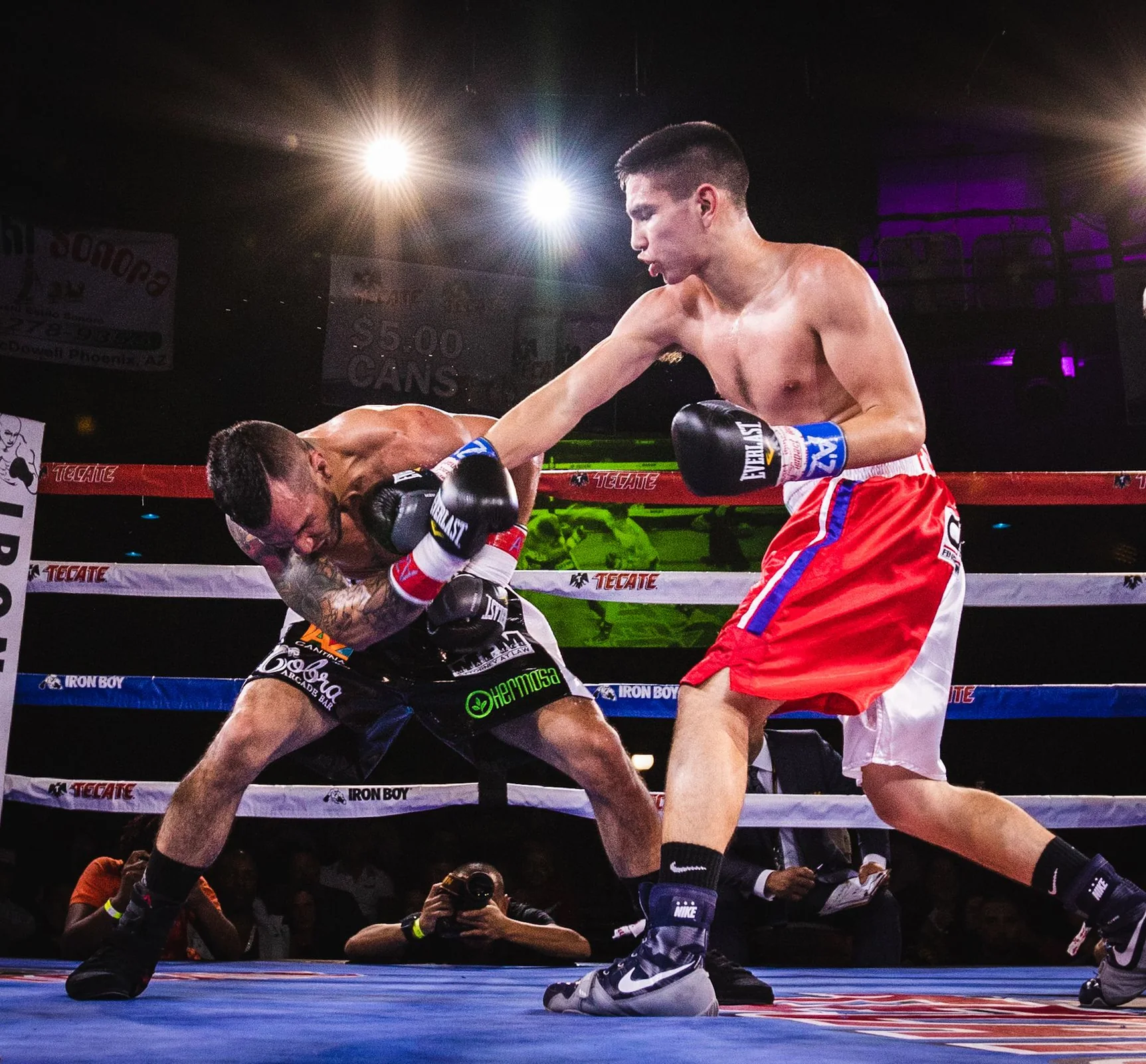 Boxing match under arena lights