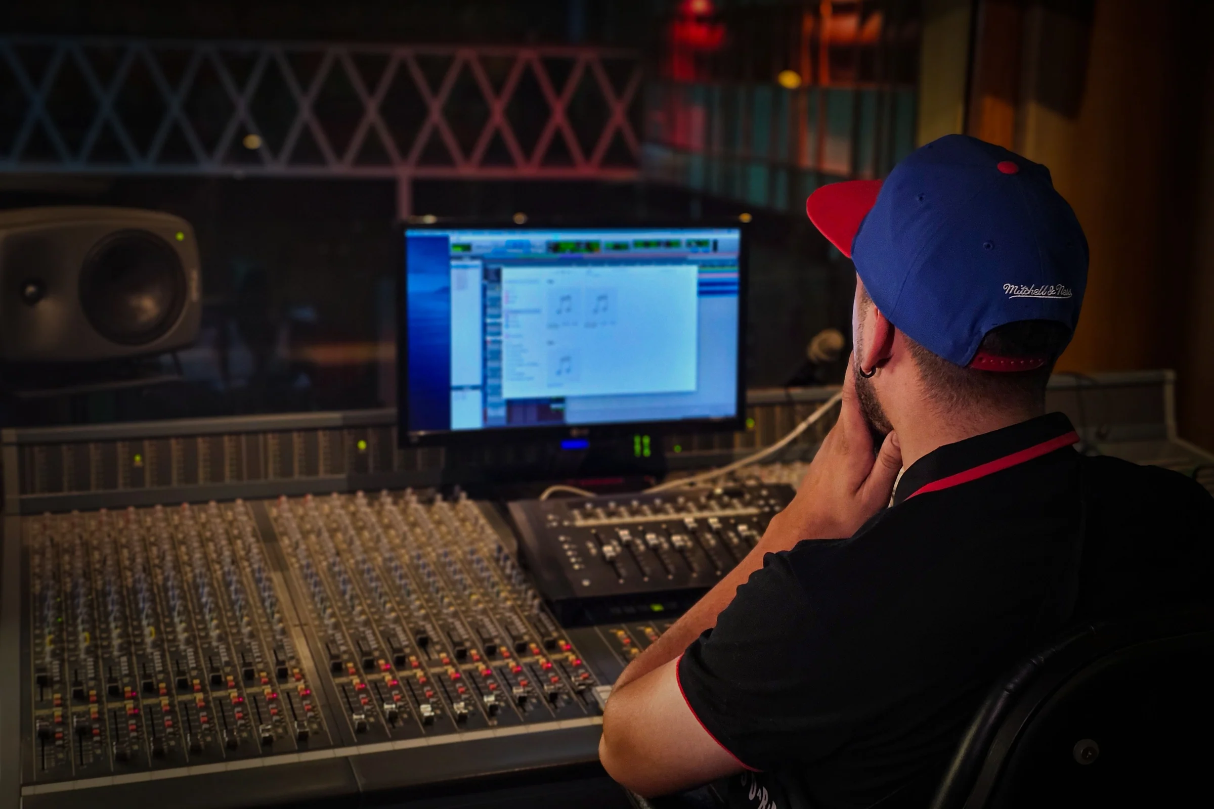 Audio engineer working at a mixing console