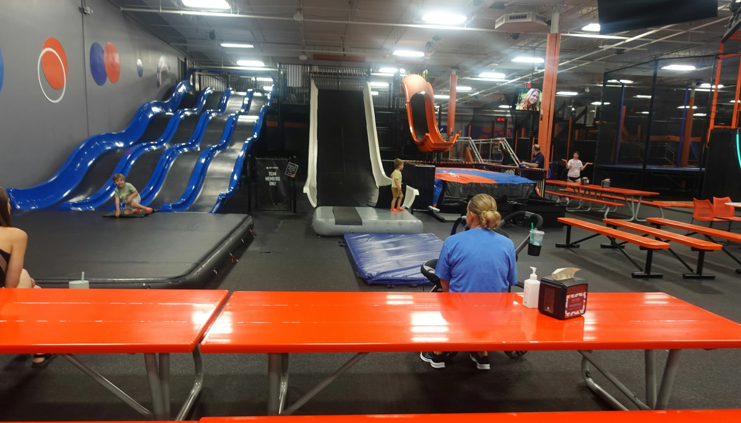 Slides and jumping attractions inside an indoor adventure park