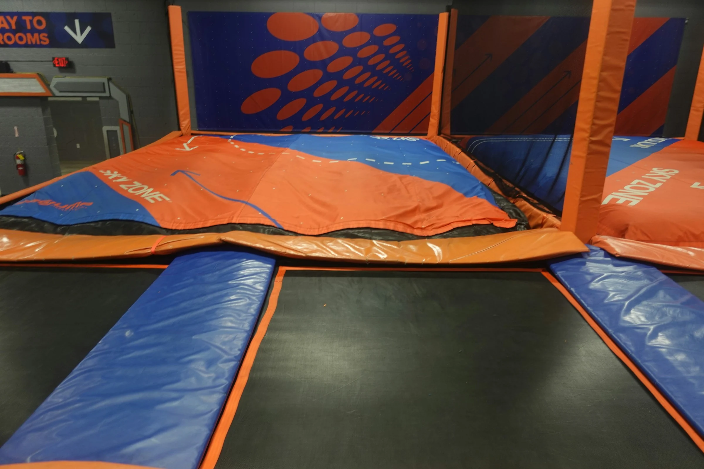 Padded trampoline courts and an airbag landing area