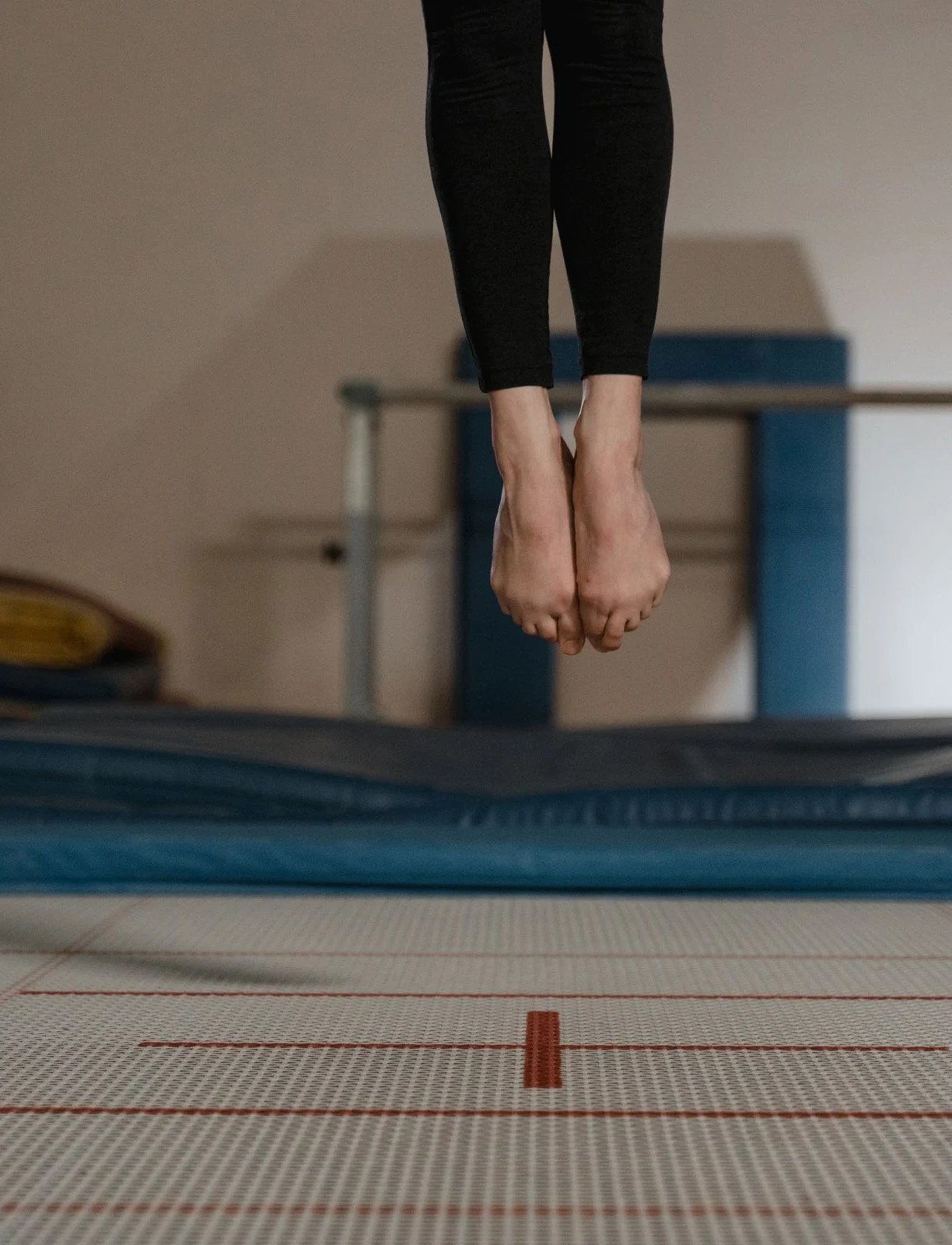 A participant jumping on an indoor trampoline